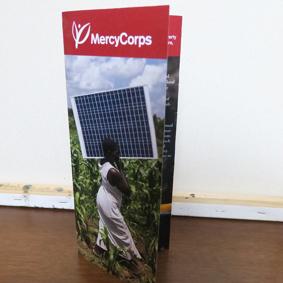 The front of a trifold brochure for the non-profit Mercy Corps.